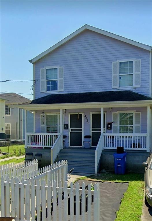4020 N Claiborne Ave, New Orleans, LA 70117 - view of front facade featuring a porch