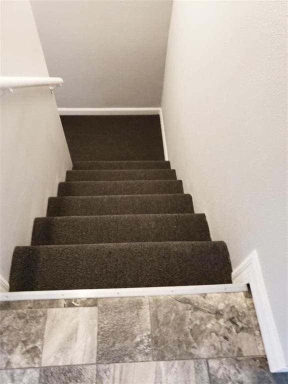 4020 N Claiborne Ave, New Orleans, LA 70117 - staircase featuring baseboards