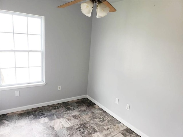 4020 N Claiborne Ave, New Orleans, LA 70117 - spare room with ceiling fan and baseboards