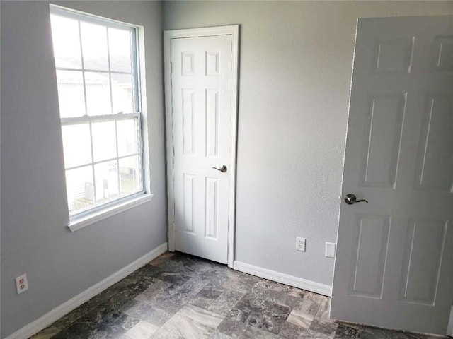 4020 N Claiborne Ave, New Orleans, LA 70117 - unfurnished bedroom featuring baseboards