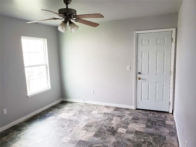 4020 N Claiborne Ave, New Orleans, LA 70117 - spare room with a ceiling fan and baseboards