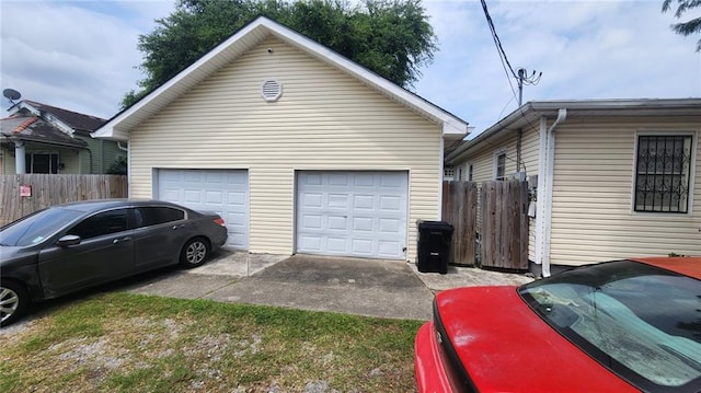 1740 Abundance St, New Orleans, LA 70119 - view of home's exterior with a detached garage and an outdoor structure