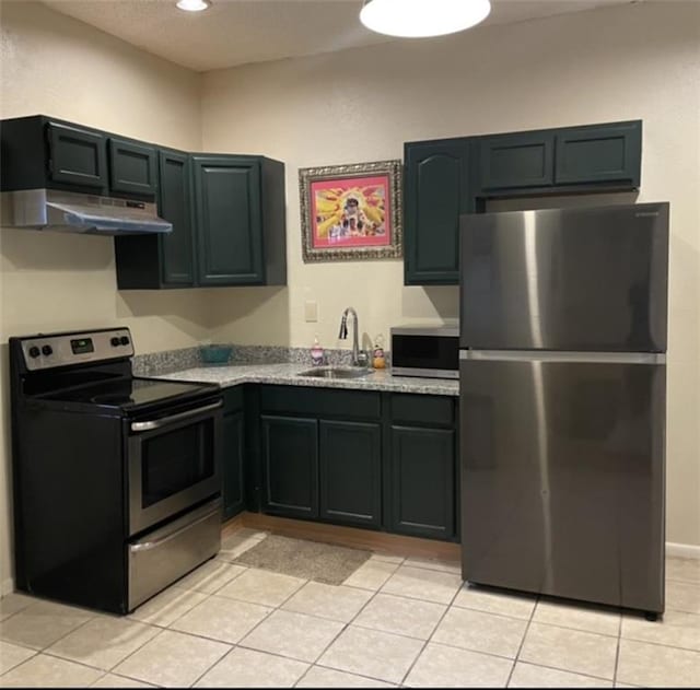 1740 Abundance St, New Orleans, LA 70119 - kitchen featuring stainless steel appliances, under cabinet range hood, a sink, light tile patterned flooring, and recessed lighting