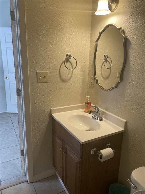 1740 Abundance St, New Orleans, LA 70119 - bathroom featuring tile patterned flooring, vanity, and toilet