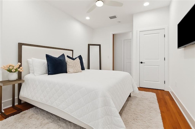 633 Tchoupitoulas St Unit 4, New Orleans, LA 70130 - bedroom with wood finished floors, recessed lighting, a ceiling fan, and baseboards