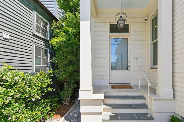 1113 9th St, New Orleans, LA 70115 - view of exterior entry with covered porch and a surveillance system