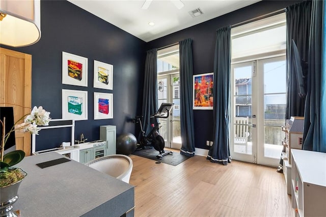 1113 9th St, New Orleans, LA 70115 - home office with light wood finished floors, ceiling fan, and recessed lighting
