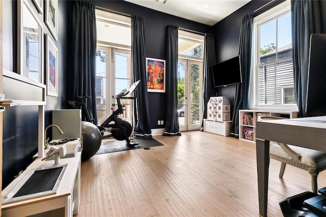 1113 9th St, New Orleans, LA 70115 - workout room with wood finished floors and baseboards