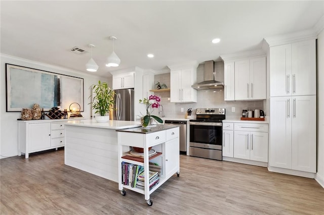 917 Belmont Pl, Metairie, LA 70001 - kitchen with wall chimney range hood, stainless steel appliances, open shelves, white cabinetry, and recessed lighting