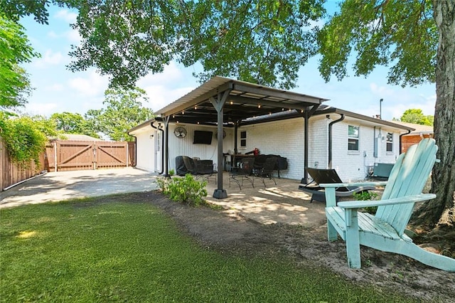 917 Belmont Pl, Metairie, LA 70001 - rear view of house with a gate, a patio, and brick siding