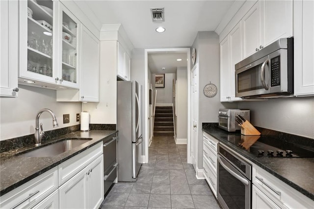 1427 Leontine St New O, Unit New O, New Orleans, LA 70115 - kitchen featuring stainless steel appliances, a sink, white cabinets, and recessed lighting