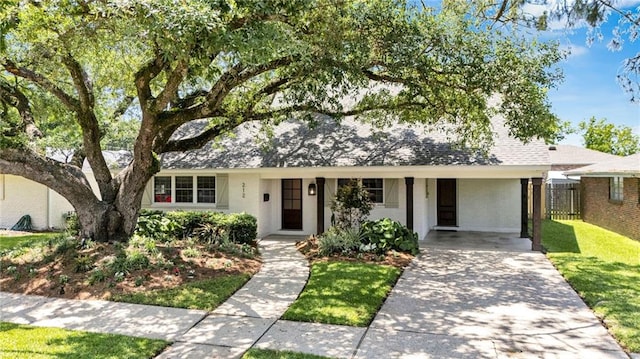 212 Nelson Dr, River Ridge, LA 70123 - view of front of home featuring driveway, an attached carport, and a shingled roof