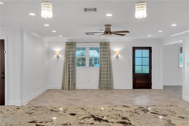 212 Nelson Dr, River Ridge, LA 70123 - tiled foyer entrance with crown molding, a chandelier, a ceiling fan, baseboards, and recessed lighting
