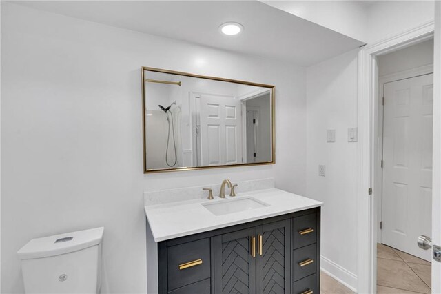 212 Nelson Dr, River Ridge, LA 70123 - bathroom with vanity, toilet, and tile patterned flooring