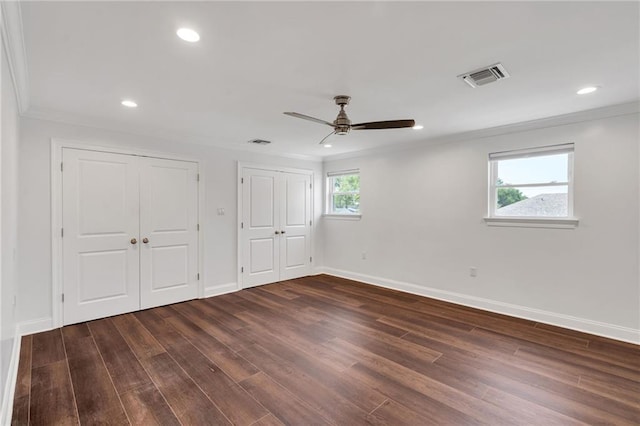 212 Nelson Dr, River Ridge, LA 70123 - unfurnished bedroom with two closets, crown molding, wood finished floors, baseboards, and recessed lighting