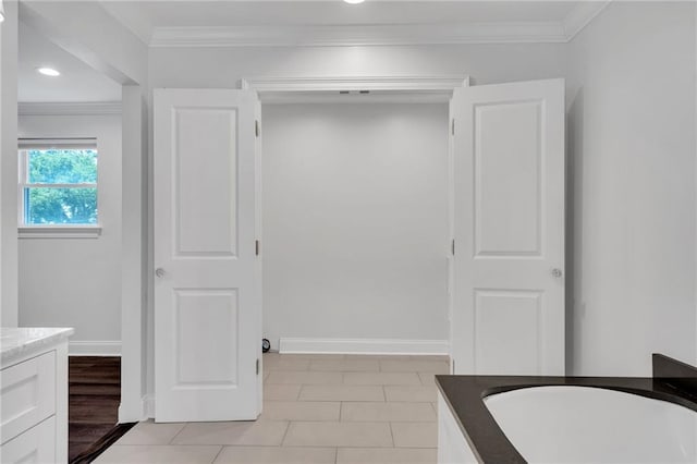212 Nelson Dr, River Ridge, LA 70123 - bathroom featuring ornamental molding, vanity, baseboards, a bath, and tile patterned flooring