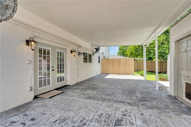 212 Nelson Dr, River Ridge, LA 70123 - view of patio / terrace with french doors and an attached carport