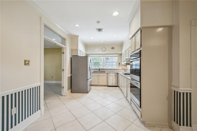 653 Fairfield Ave, Gretna, LA 70056 - kitchen featuring appliances with stainless steel finishes, under cabinet range hood, crown molding, a sink, and light countertops