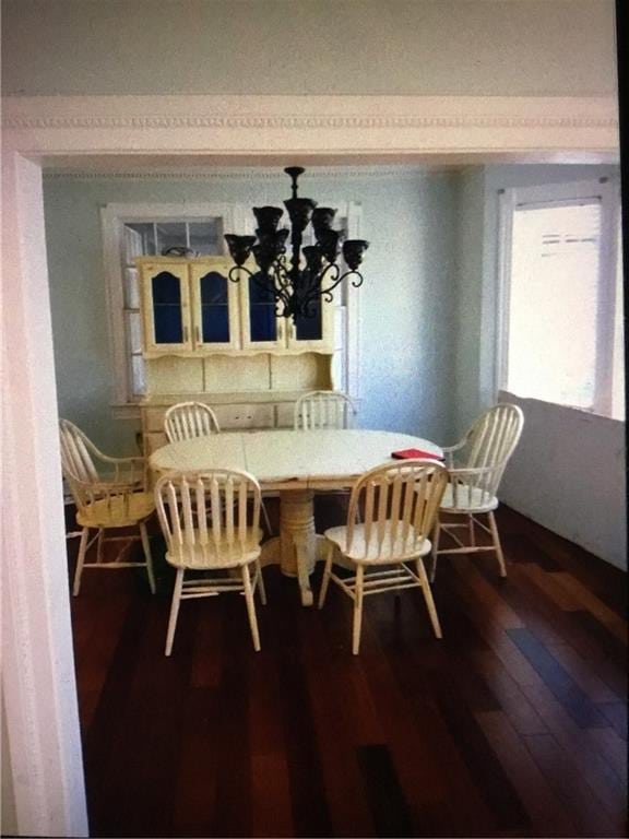 4649 Dart St, New Orleans, LA 70125 - dining room featuring wood finished floors and a chandelier