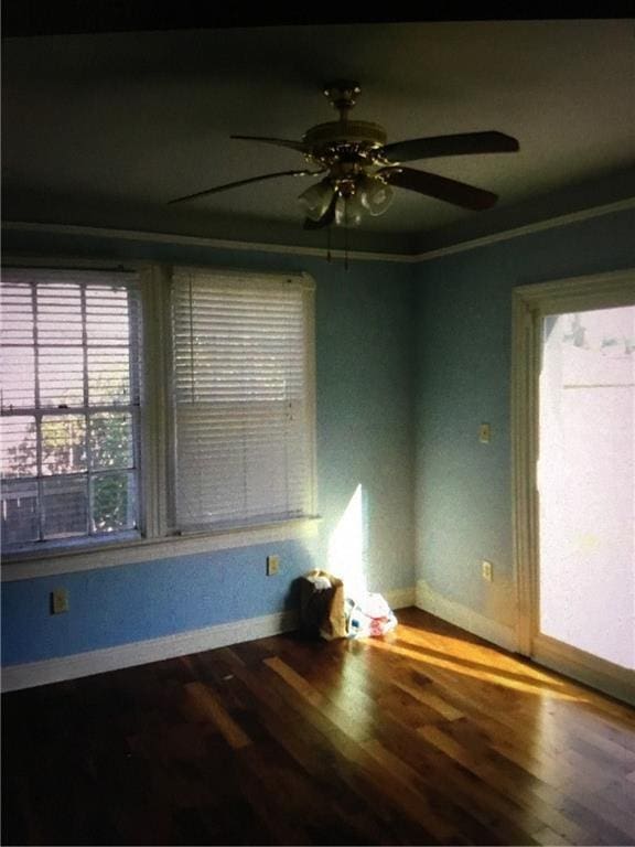 4649 Dart St, New Orleans, LA 70125 - spare room with baseboards, a ceiling fan, and wood finished floors