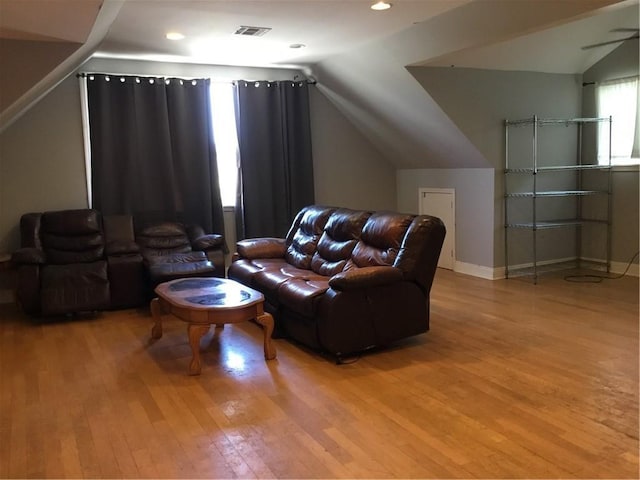 4649 Dart St, New Orleans, LA 70125 - living room featuring light wood-type flooring, vaulted ceiling, baseboards, and recessed lighting