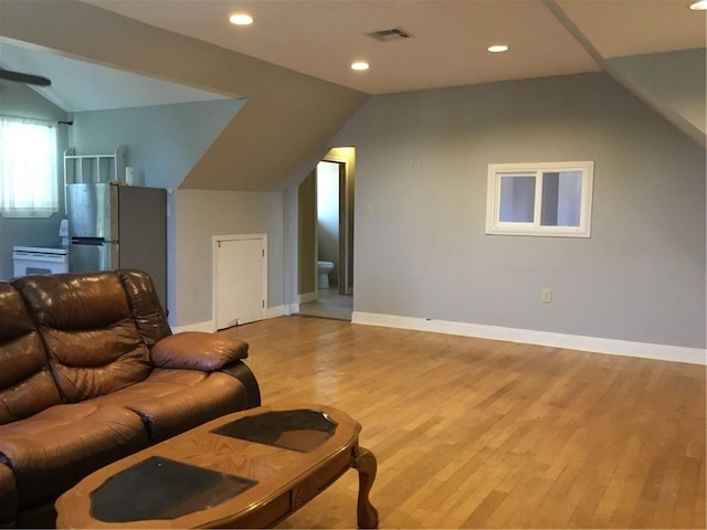 4649 Dart St, New Orleans, LA 70125 - living room with vaulted ceiling, light wood-style flooring, recessed lighting, and baseboards