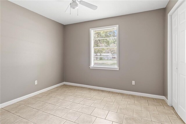 150 Manor Dr, Ponchatoula, LA 70454 - empty room with a ceiling fan, baseboards, and light tile patterned floors