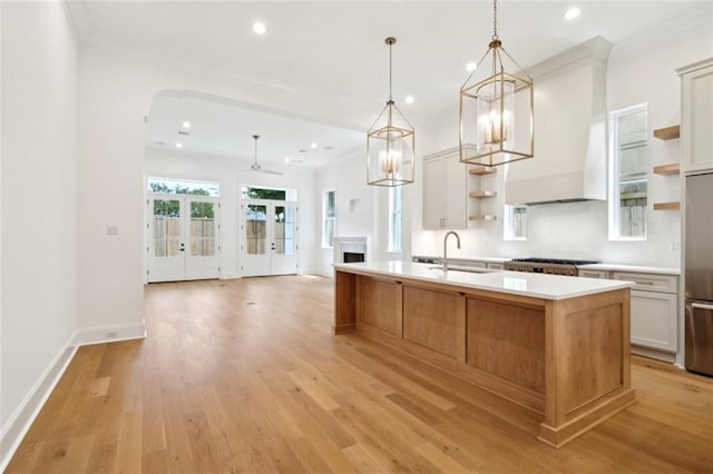 325 Focis St, Metairie, LA 70005 - kitchen with open shelves, a sink, light wood-type flooring, recessed lighting, and crown molding