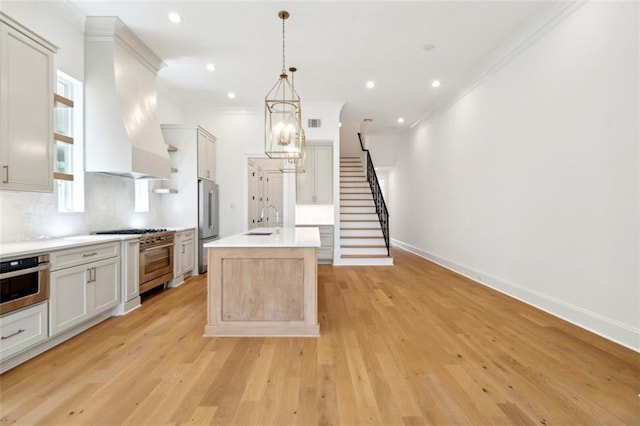 325 Focis St, Metairie, LA 70005 - kitchen featuring a sink, high quality appliances, custom range hood, crown molding, and open shelves