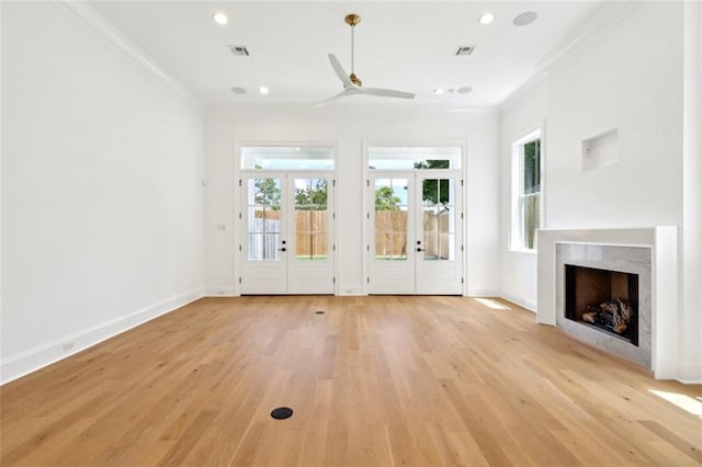325 Focis St, Metairie, LA 70005 - unfurnished living room featuring crown molding, french doors, healthy amount of natural light, light wood finished floors, and ceiling fan