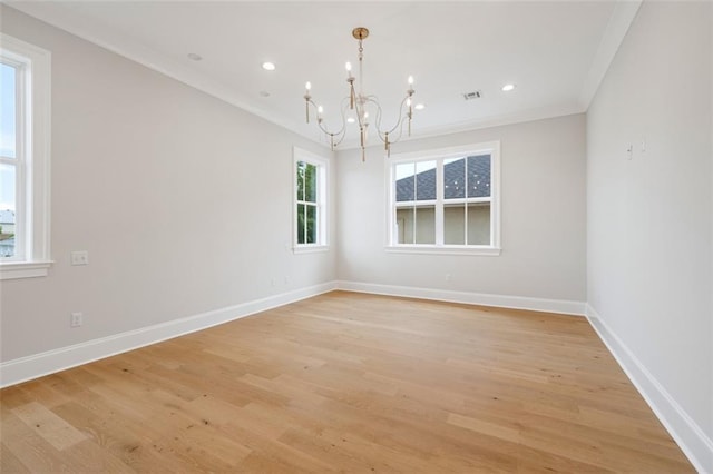 325 Focis St, Metairie, LA 70005 - spare room with a chandelier, baseboards, light wood-style flooring, recessed lighting, and crown molding