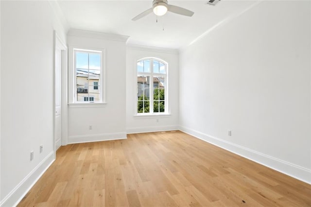 325 Focis St, Metairie, LA 70005 - spare room with light wood finished floors, crown molding, baseboards, and a ceiling fan