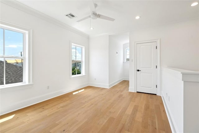 325 Focis St, Metairie, LA 70005 - unfurnished room with light wood-style floors, a ceiling fan, recessed lighting, baseboards, and crown molding