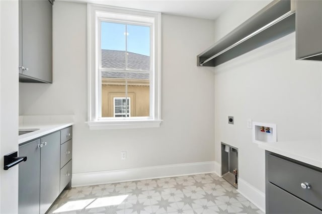 325 Focis St, Metairie, LA 70005 - laundry room with cabinet space, light floors, hookup for a washing machine, electric dryer hookup, and baseboards
