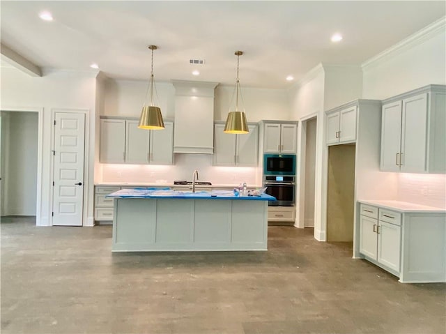 1337 Avenue Lacroix Ave, Lacroix, Covington, LA 70433 - kitchen featuring stainless steel oven, built in microwave, crown molding, decorative light fixtures, and an island with sink