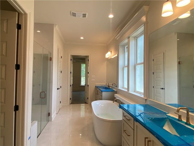 1337 Avenue Lacroix Ave, Lacroix, Covington, LA 70433 - full bath with two vanities, a stall shower, ornamental molding, a freestanding tub, and recessed lighting