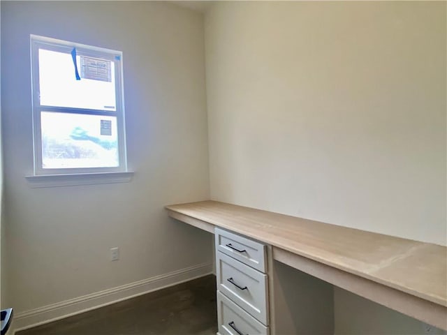 1337 Avenue Lacroix Ave, Lacroix, Covington, LA 70433 - unfurnished office featuring built in desk, baseboards, and dark wood-type flooring