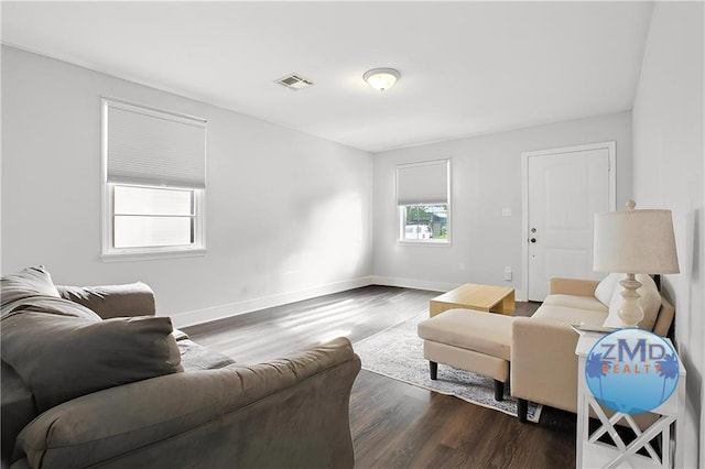 4819 Touro St, New Orleans, LA 70122 - living area with dark wood-style flooring and baseboards