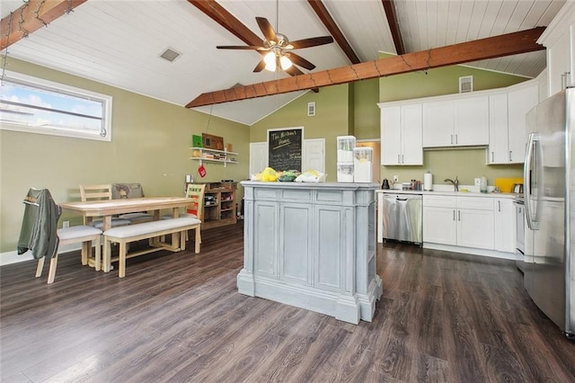 4819 Touro St, New Orleans, LA 70122 - kitchen featuring appliances with stainless steel finishes, dark wood-style floors, white cabinetry, and wooden ceiling
