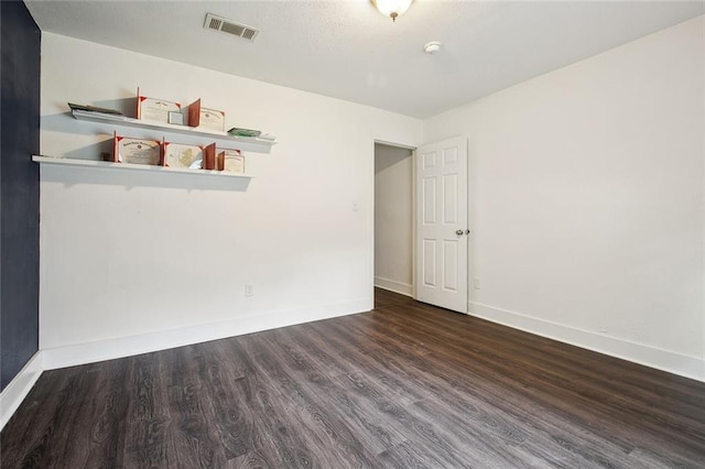 4819 Touro St, New Orleans, LA 70122 - empty room with wood finished floors, baseboards, and a smoke detector