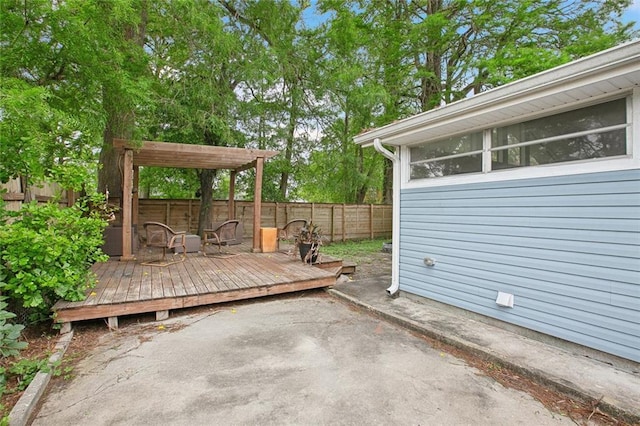 4819 Touro St, New Orleans, LA 70122 - fenced backyard with a wooden deck and a patio area
