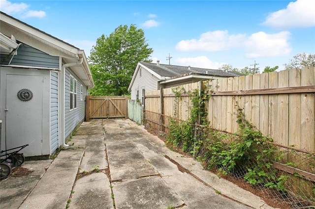4819 Touro St, New Orleans, LA 70122 - view of patio with a gate and concrete driveway