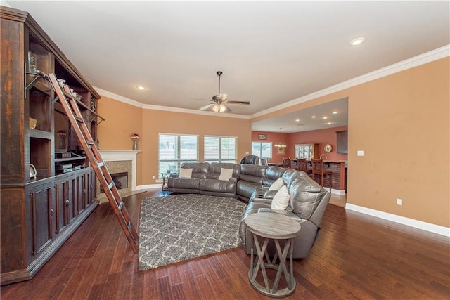 422 Scotch Pine Dr, Ponchatoula, LA 70454 - living area with baseboards, dark wood finished floors, ceiling fan, ornamental molding, and recessed lighting
