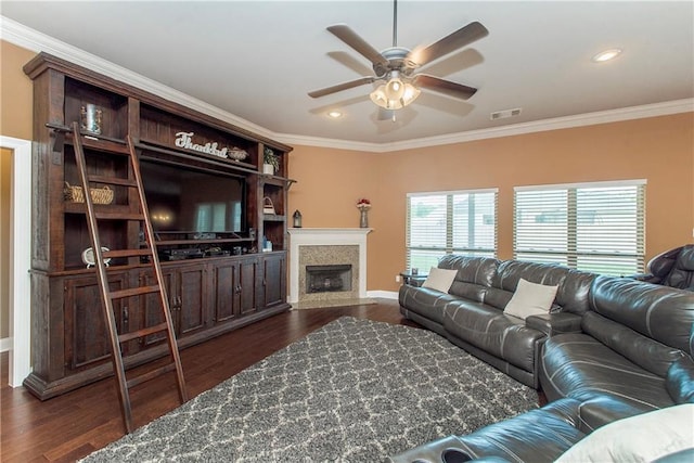 422 Scotch Pine Dr, Ponchatoula, LA 70454 - living room with ceiling fan, dark wood-type flooring, ornamental molding, baseboards, and a fireplace with flush hearth