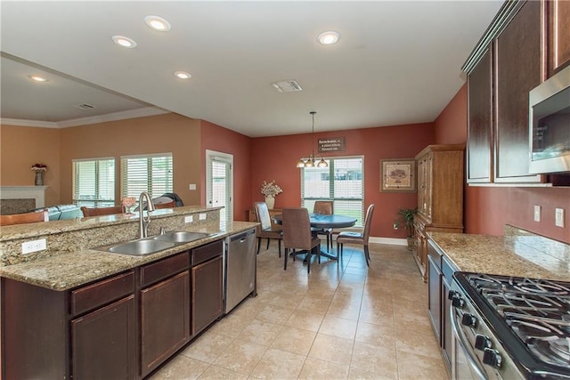 422 Scotch Pine Dr, Ponchatoula, LA 70454 - kitchen featuring a sink, stainless steel appliances, dark brown cabinetry, recessed lighting, and decorative light fixtures