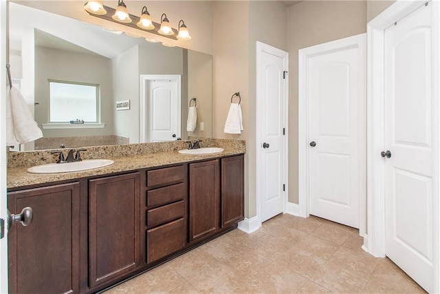 422 Scotch Pine Dr, Ponchatoula, LA 70454 - full bath featuring double vanity, tile patterned floors, baseboards, and a closet