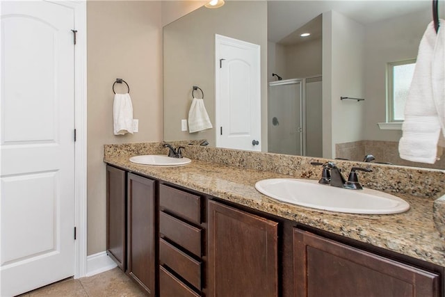 422 Scotch Pine Dr, Ponchatoula, LA 70454 - full bathroom featuring a stall shower, double vanity, and tile patterned floors