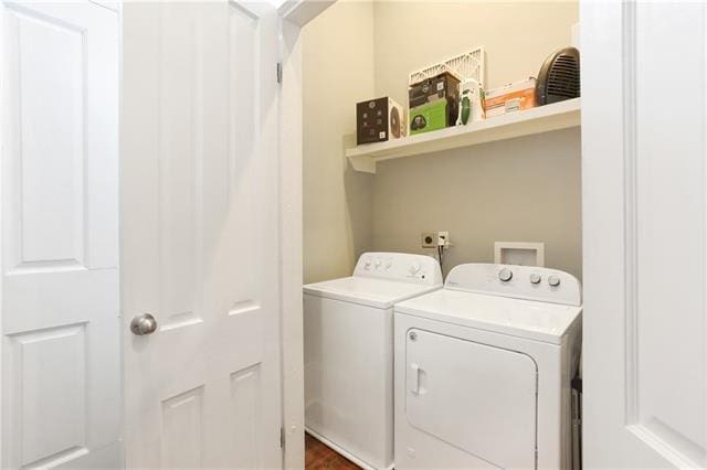 1355 Columbus St, New Orleans, LA 70116 - laundry room featuring washer and clothes dryer and dark wood-style flooring