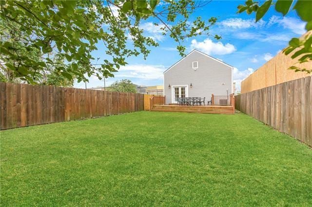 1355 Columbus St, New Orleans, LA 70116 - rear view of house featuring a fenced backyard and a deck