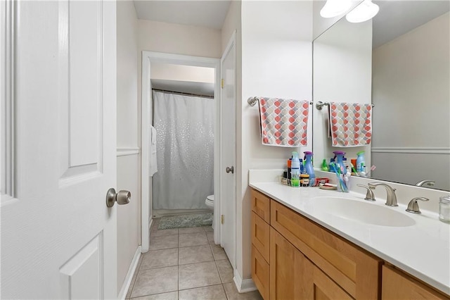 65 Monterrey Dr, Kenner, LA 70065 - full bathroom with vanity, toilet, tile patterned floors, a shower with curtain, and baseboards